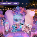 Personalized blue alien birthday backdrop and cutouts with purple pink and blue balloons, tropical details and luxury kids party decor