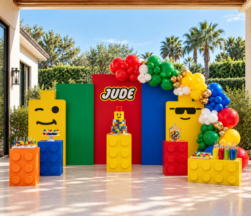 Colorful brick birthday setup with custom backdrop panels, balloon garland and personalized building block party decorations.