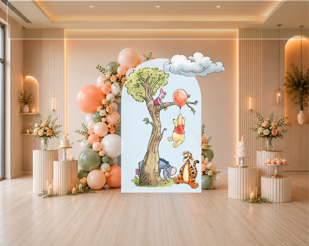 Classic bear party backdrop with woodland tree, pastel arch panels and colorful character cutouts for a sweet baby celebration.