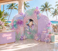Mermaid birthday backdrop set in pastel pink purple and aqua for an outdoor poolside celebration