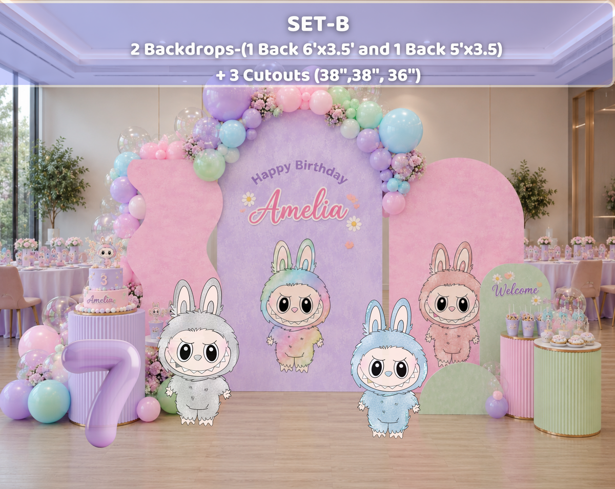 Purple and pink monster birthday backdrop with neon lighting effect, balloon garland and personalized kids party decorations.