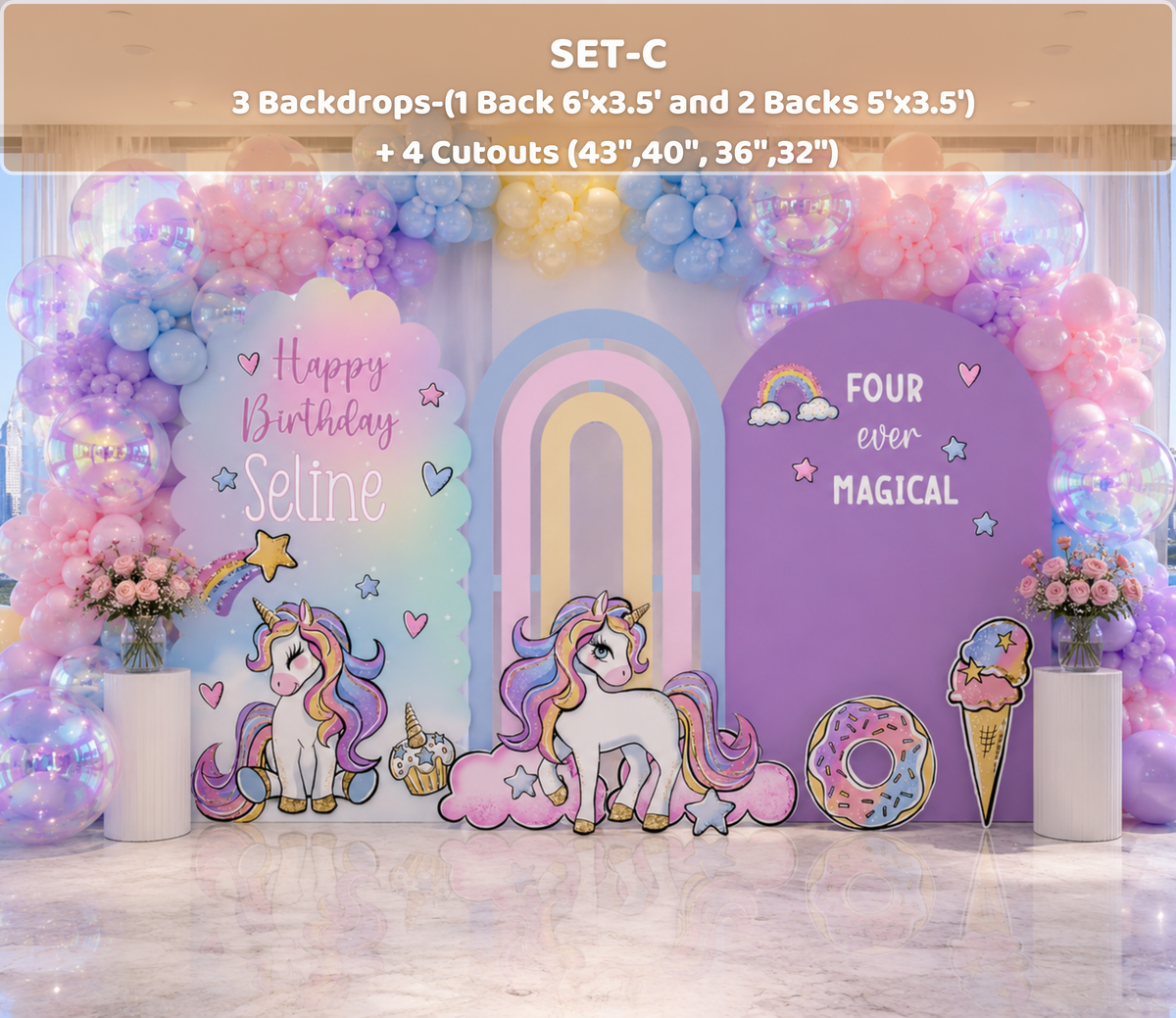 Purple unicorn birthday backdrop with pastel balloon garland, rainbow design and personalized party decorations for an indoor event.