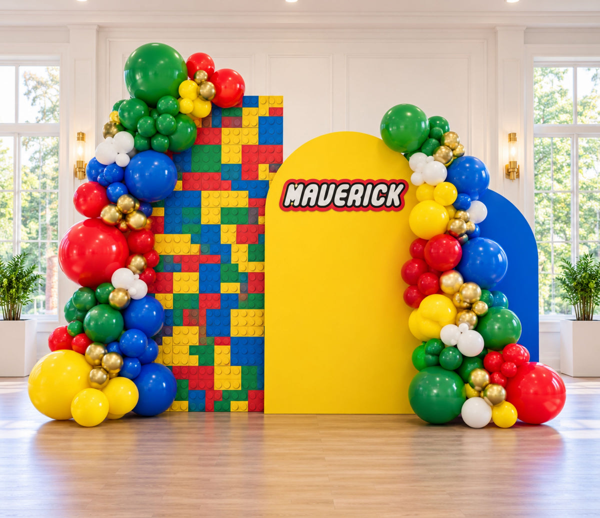 Personalized building block party display with colorful arch panels, bright balloons and playful birthday styling.