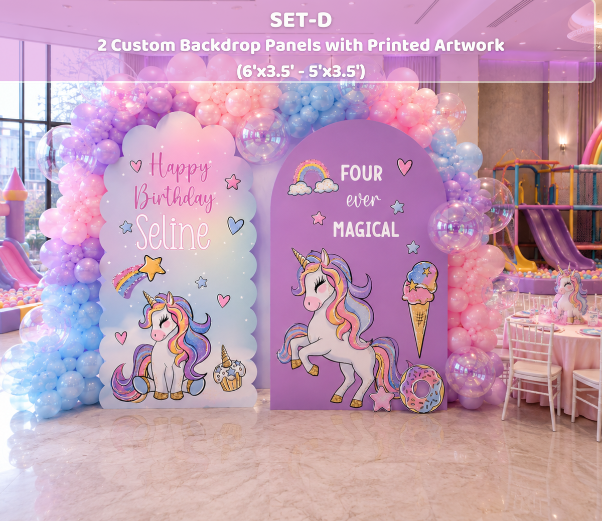 Bright pink and purple unicorn birthday setup with layered arch backdrops, balloon decorations and matching character cutouts.