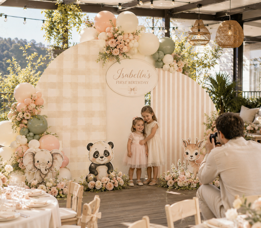 Little animal friends party backdrop with blush pink panels, balloons and woodland animal cutouts