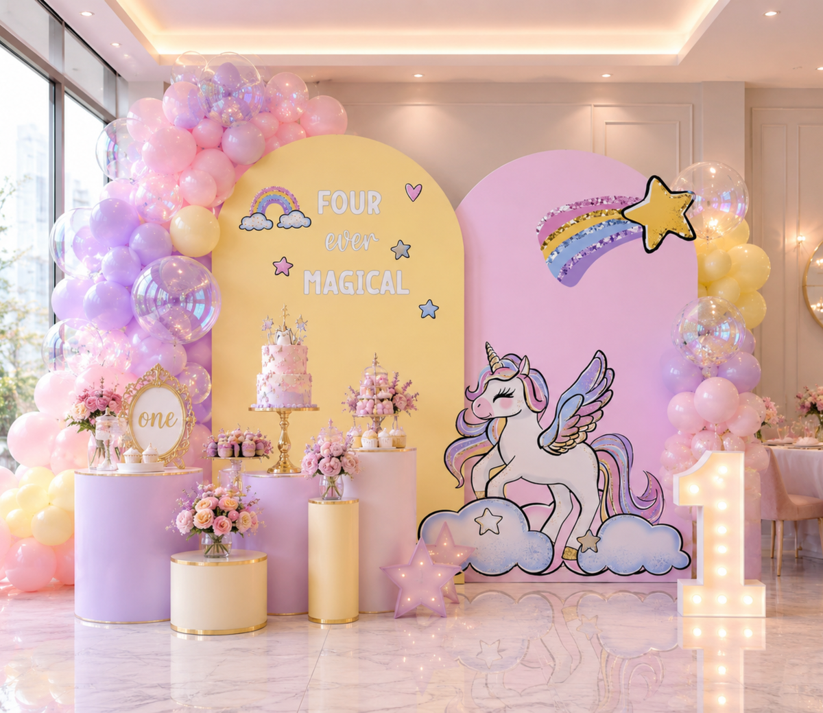 Yellow and pink unicorn party backdrop with pastel rainbow details, balloon clusters and unicorn cutouts for a colorful birthday.