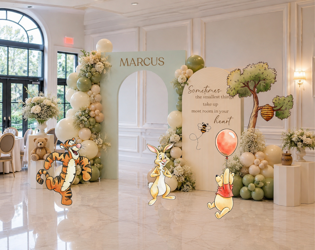 Elegant classic bear party backdrop with peach and blue panels, woodland styling and personalized baby shower decorations.