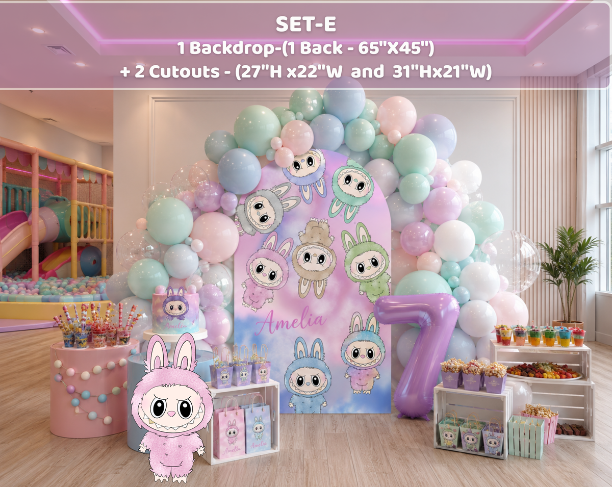 Indoor pastel monster birthday decorations with lavender and pink backdrop panels, cute monster cutouts and soft balloon styling.