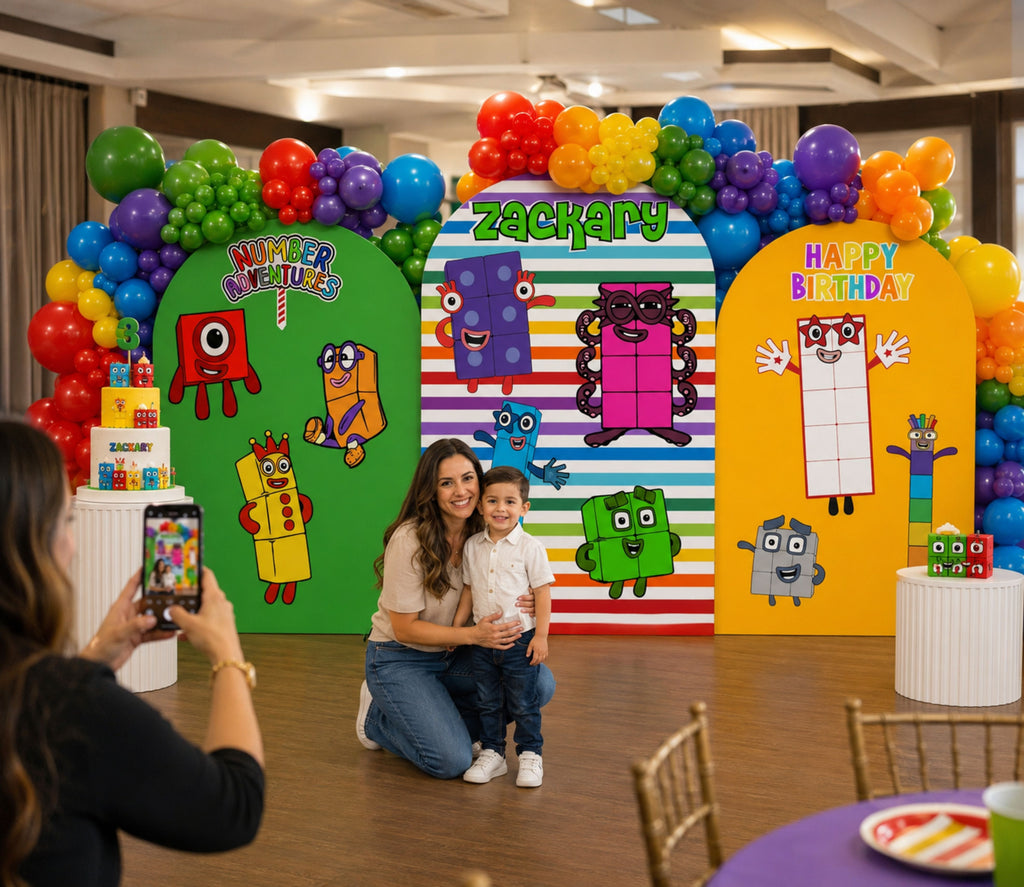 Numberblocks birthday backdrop displayed in a colorful indoor party venue with character panels, balloons and personalized decorations.