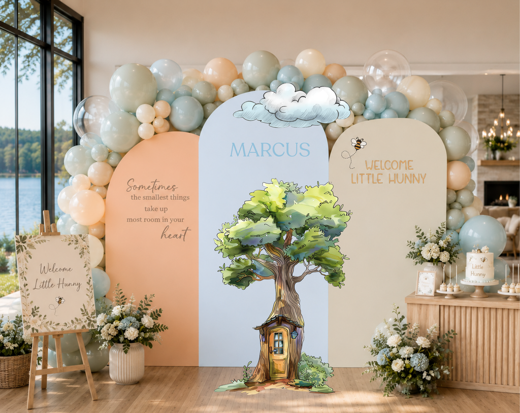 Woodland baby celebration backdrop with classic bear inspired characters, soft pastel balloons and personalized arch panels.
