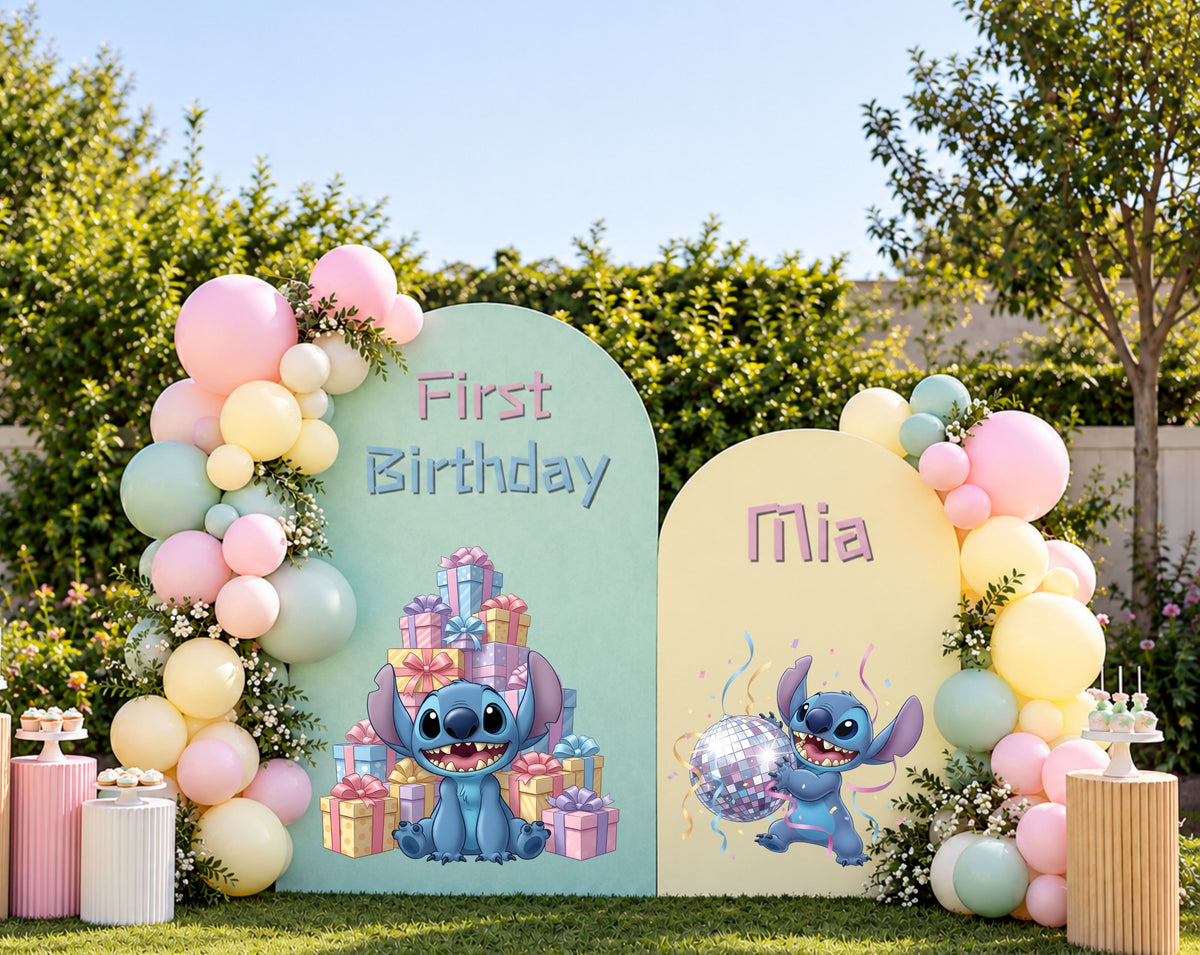 Outdoor pastel blue alien party backdrop with oval arch panels, balloon garland and personalized birthday decorations.