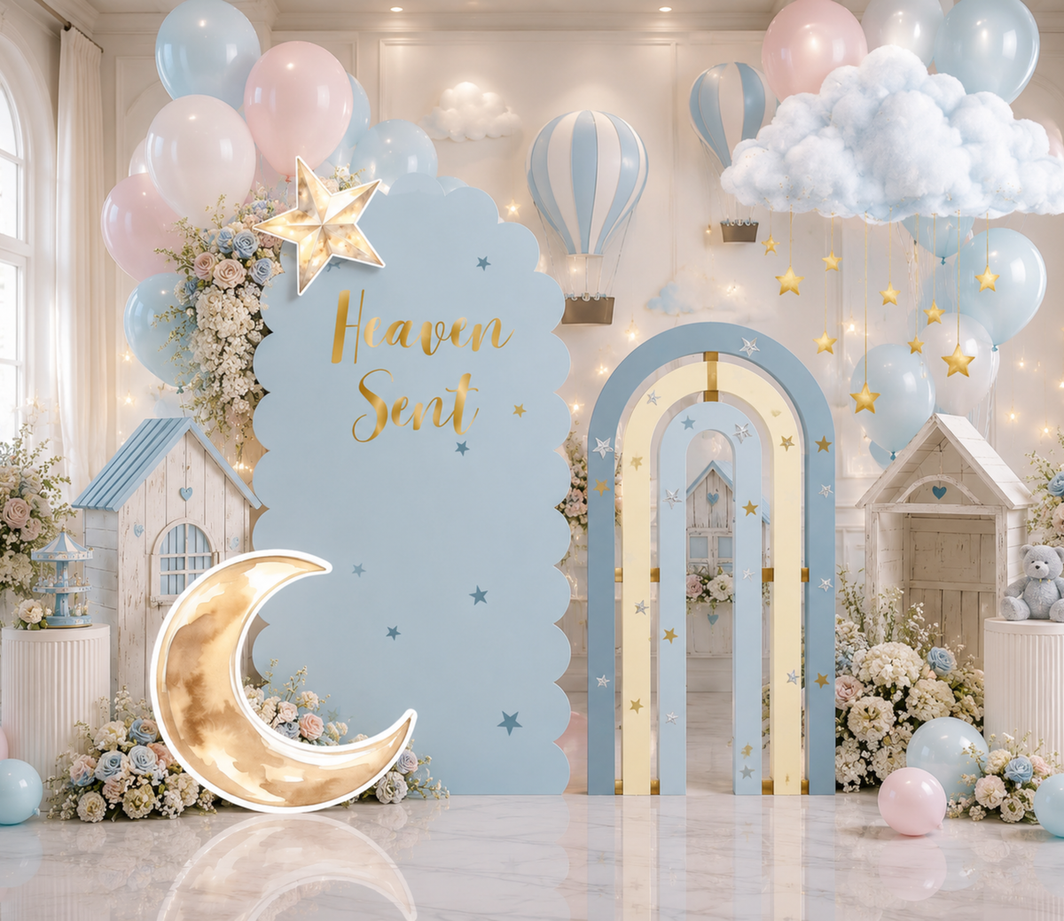 Elegant Heaven Sent baby shower display with ivory backdrop, crescent moon decor and soft white neutral celestial party styling.