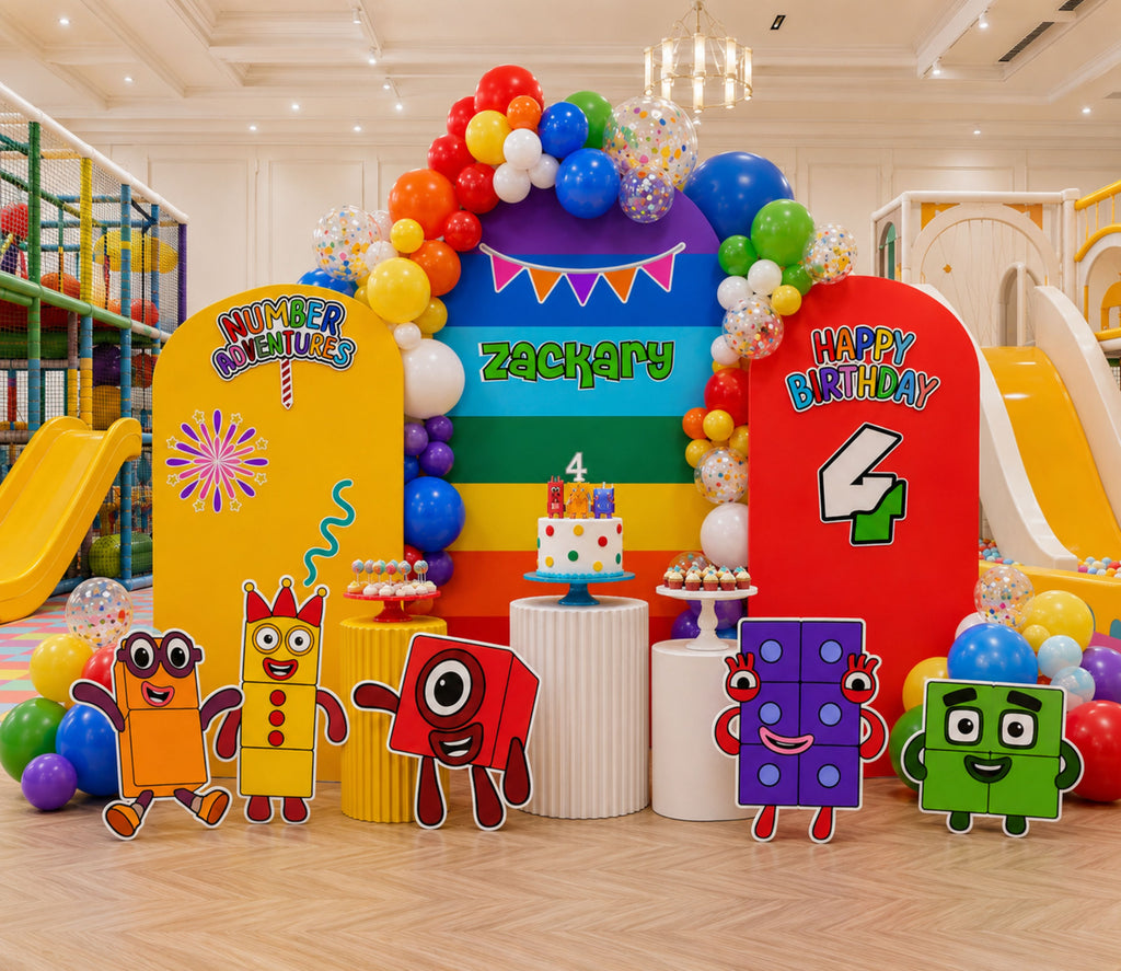 Colorful Numberblocks birthday backdrop and cutout set with number characters, rainbow balloon garland and playful party styling.