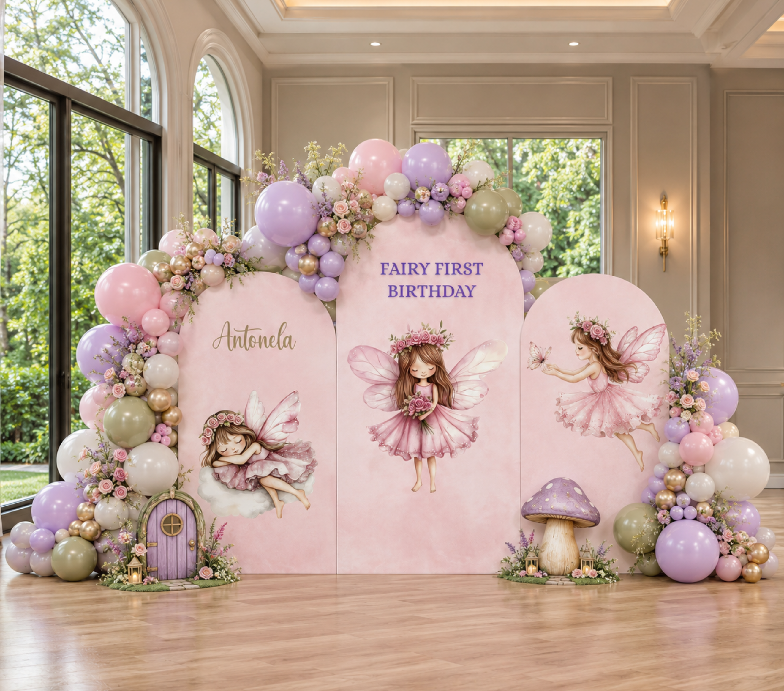 Personalized pink fairy birthday backdrop with pastel balloon garland, enchanted forest details and fairy cutouts for a magical first birthday celebration.