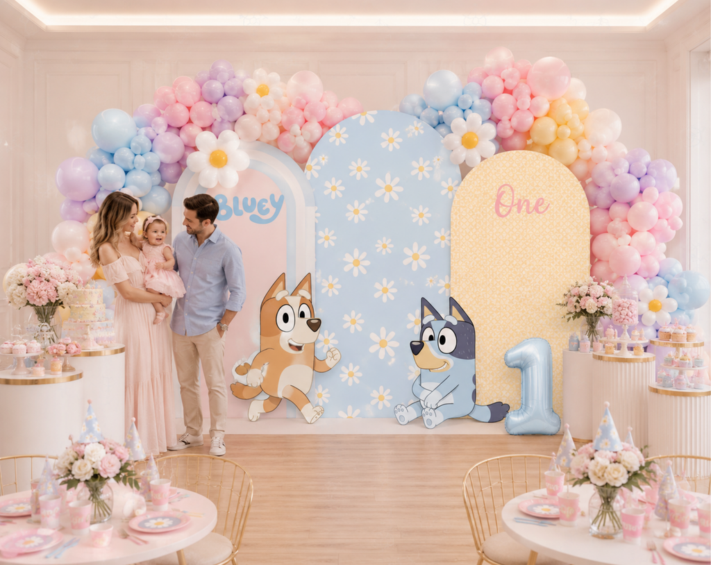 Personalized puppy birthday backdrop with pink and blue arch panels, pastel balloons and puppy family character party decorations.