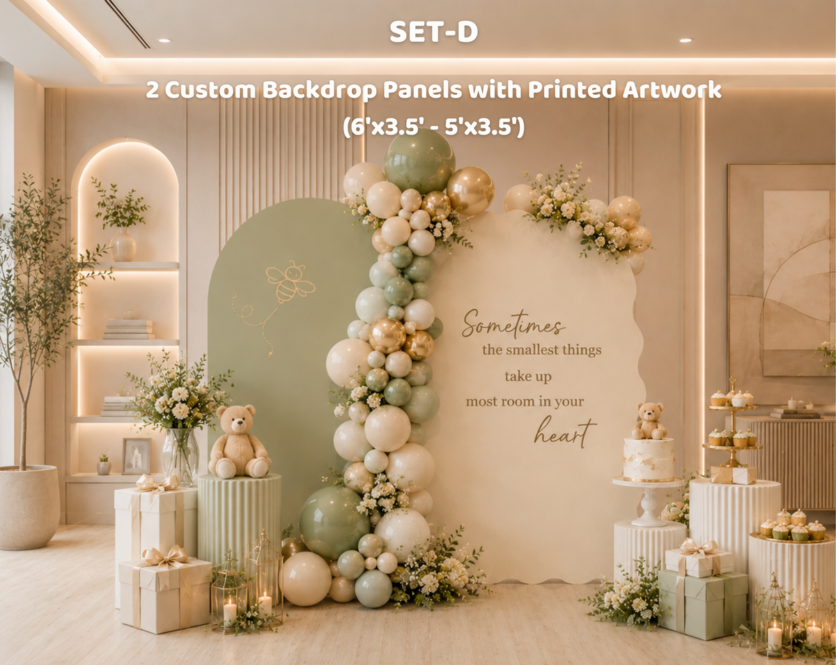 Neutral woodland baby shower backdrop with beige panel, delicate floral balloon garland and classic bear inspired party decorations.