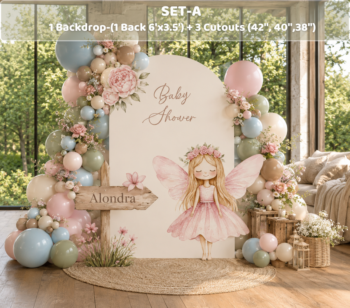 Outdoor pink fairy birthday backdrop with floral arch, pastel balloons and enchanted garden party decorations.