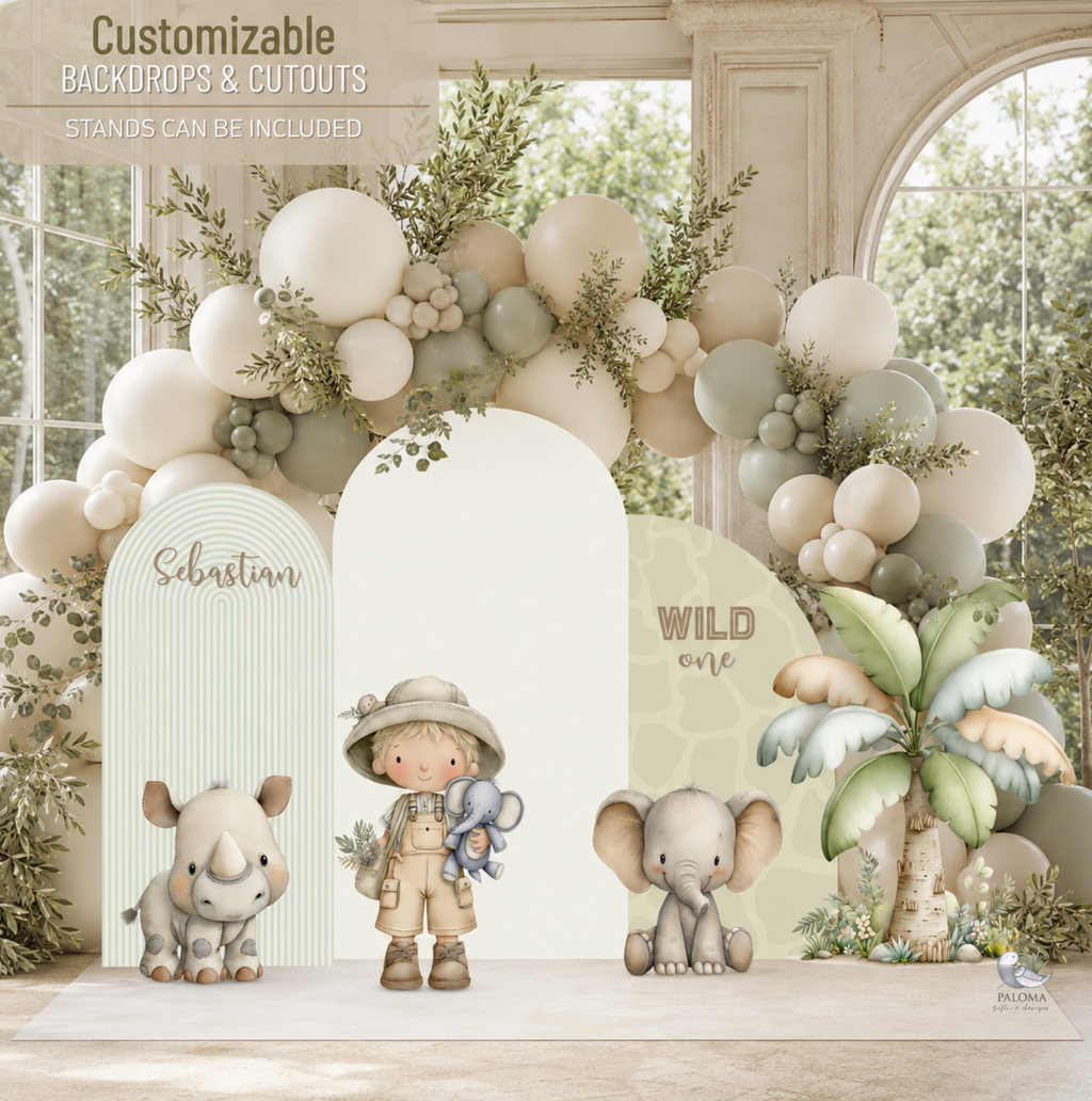 Personalized safari baby shower backdrop with neutral balloon garland, safari animal cutouts, palm leaves and soft beige and sage green party decor.