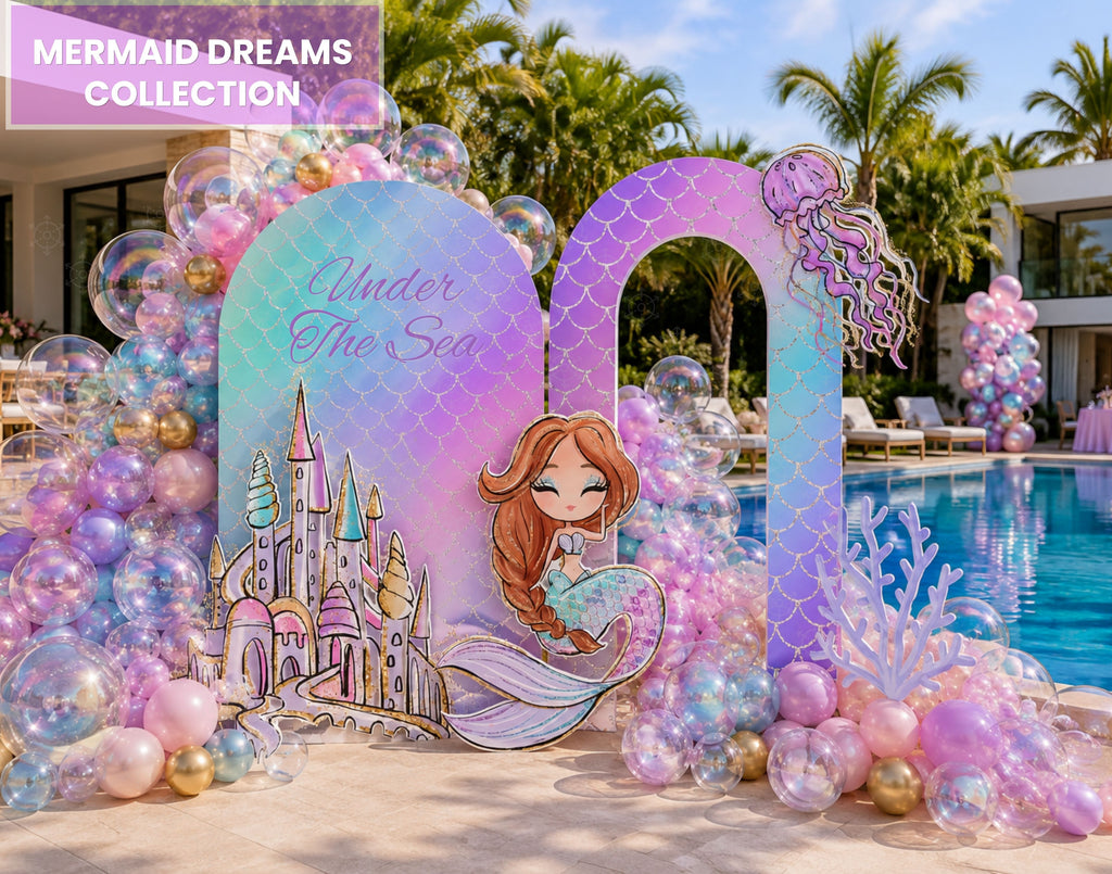 Outdoor mermaid birthday backdrop with pastel rainbow arches, tropical palm details, balloons and under the sea party decorations.