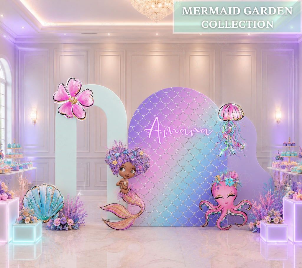Pastel little mermaid first birthday backdrop with personalized rainbow panel and under the sea character cutouts