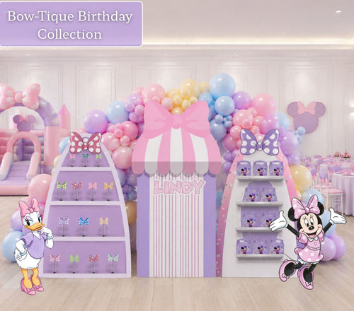 Personalized Bow-Tique birthday party backdrop with pink and lavender boutique shelves, bow displays, Minnie Mouse and Daisy Duck cutouts, and pastel balloon decor.