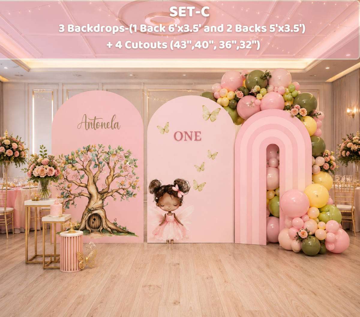 Pastel fairy birthday backdrop with pink arch panels, balloon garland and enchanted floral decorations for a girls celebration.