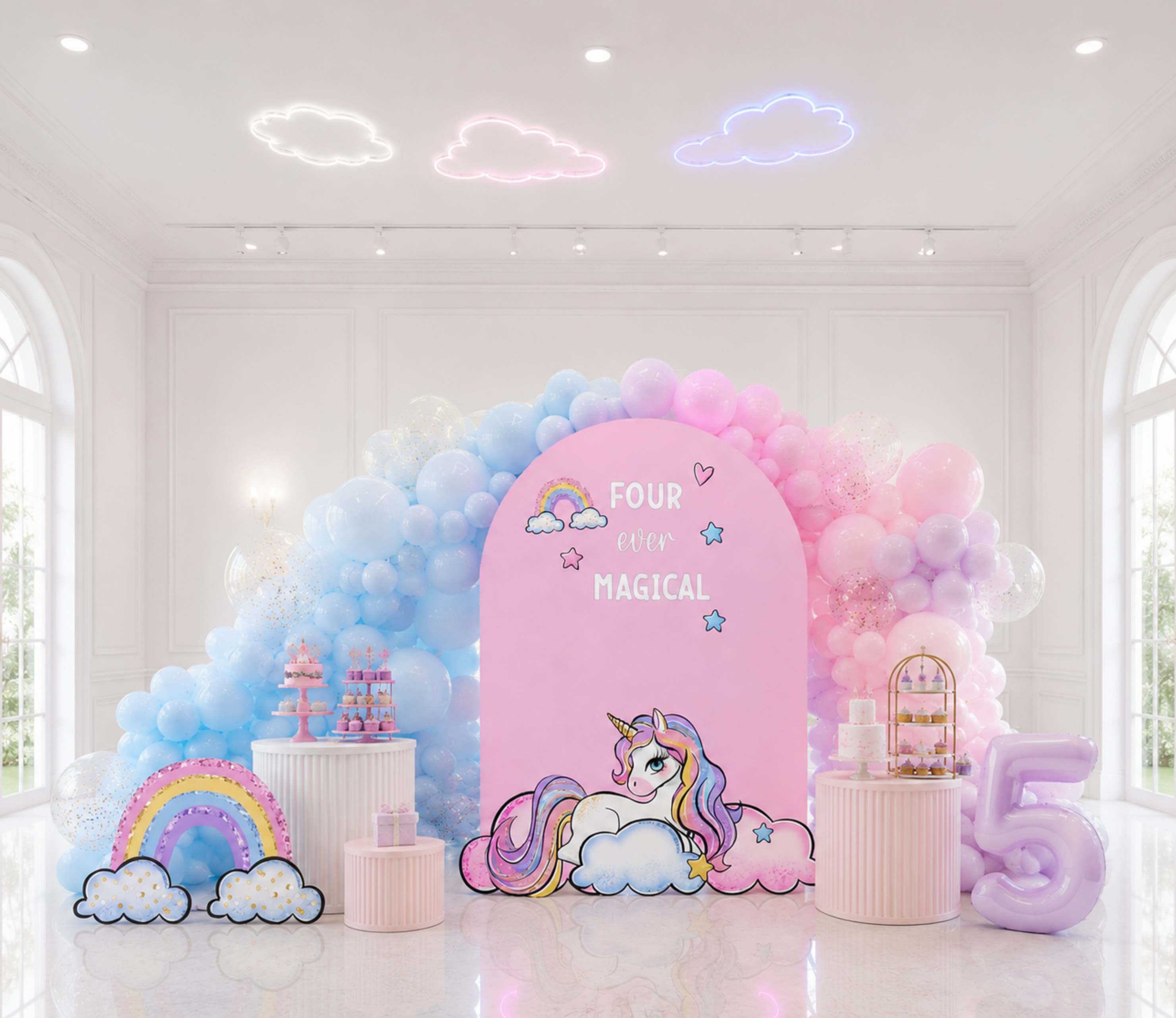 Pastel pink and blue unicorn birthday backdrop with rainbow details, balloon accents and matching unicorn cutouts for a kids party.