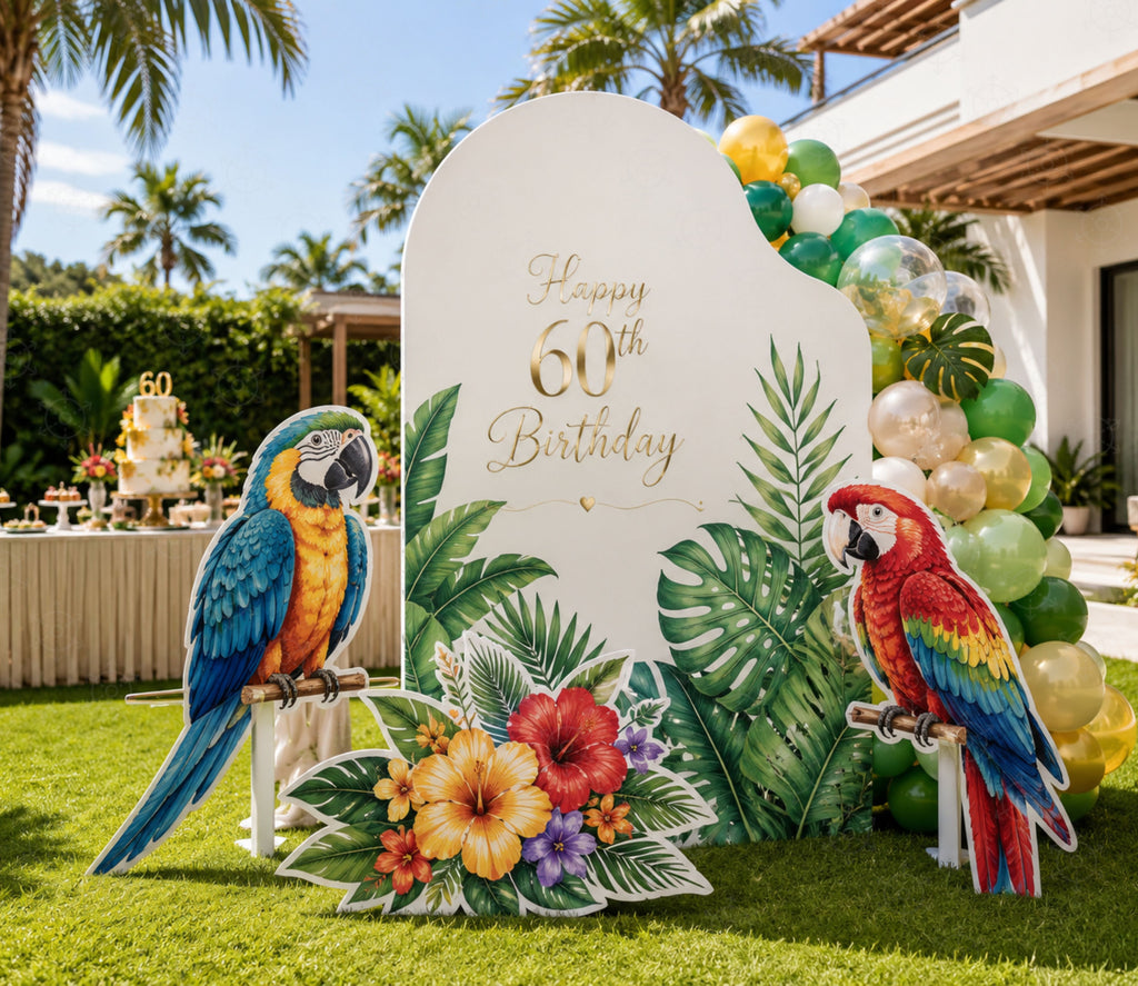 Tropical birthday backdrop with colorful parrots, greenery and bright floral party decorations