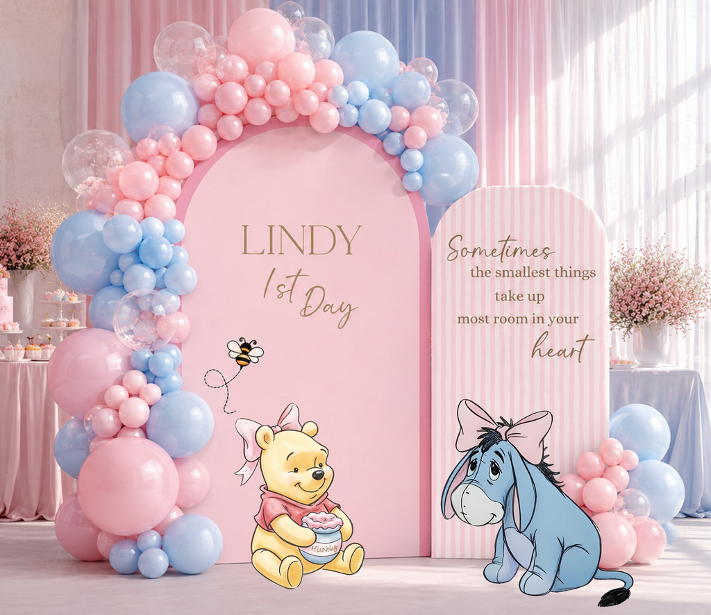Pastel Honey Bear birthday backdrop with pink balloons and personalized storybook character cutouts.