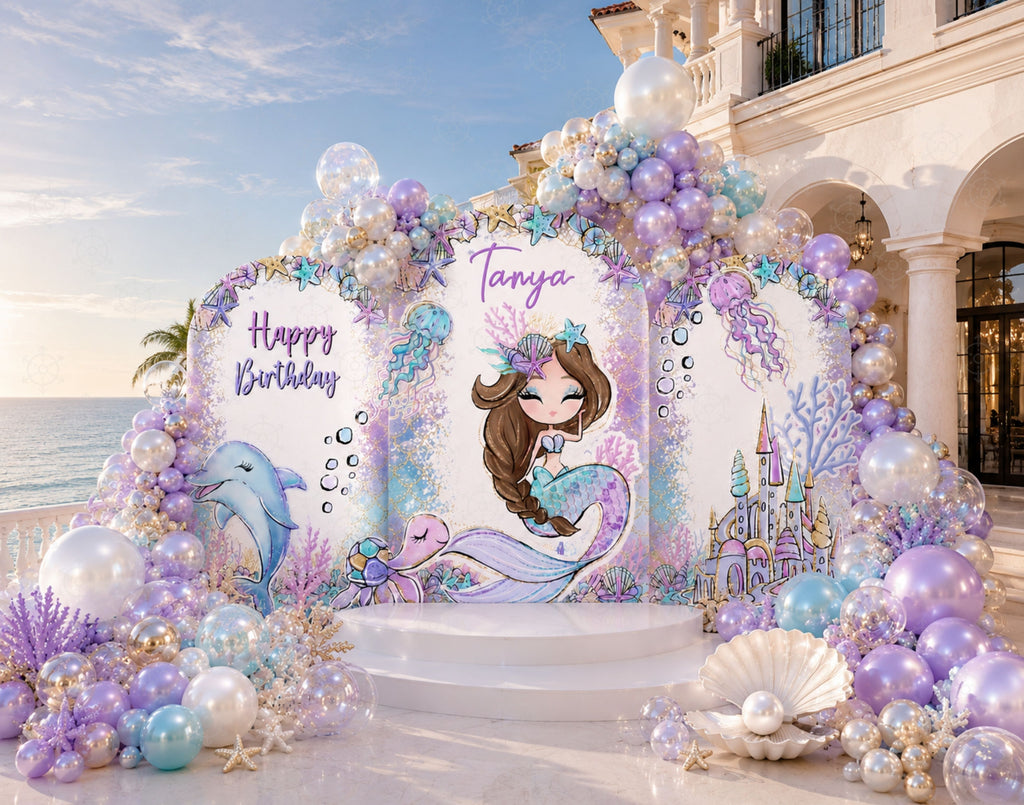 Personalized mermaid birthday backdrop with pastel purple and aqua balloons, under the sea details, seashell accents and matching mermaid cutouts.