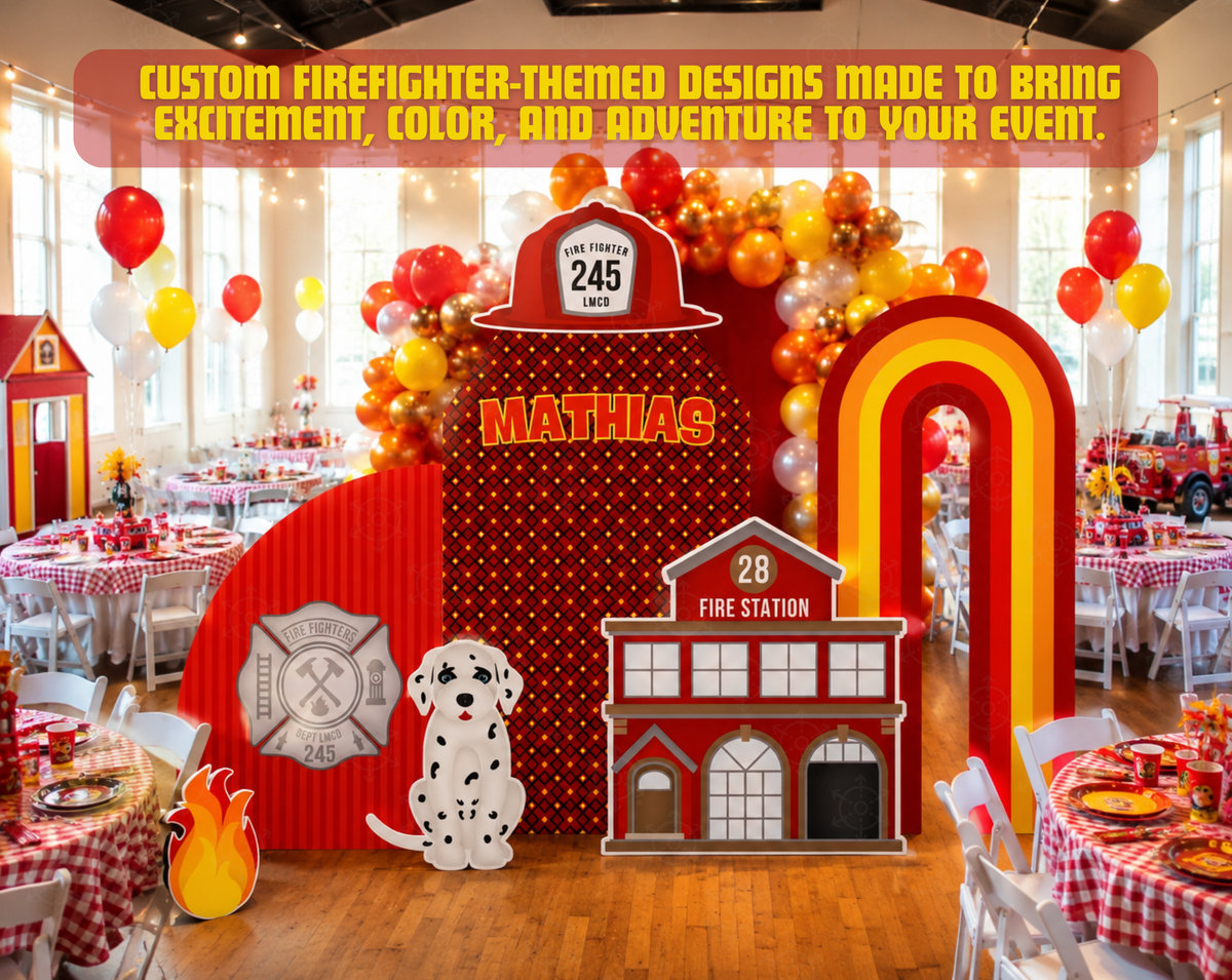 Firefighter birthday party backdrop with layered red firehouse panels, city building details, a ladder truck cutout and red, yellow and orange balloon garlands.