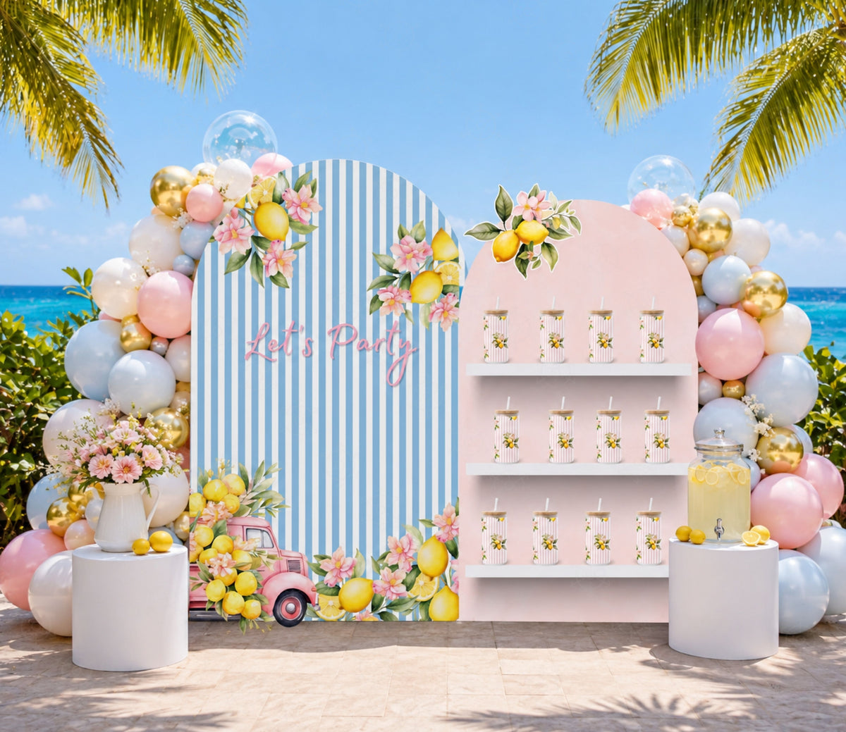 Pastel lemon party backdrop set with pink florals and hanging lemon decorations