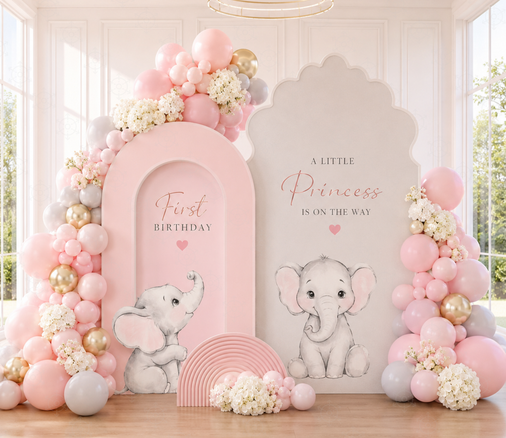 Pink baby elephant baptism backdrop with matching cutouts, soft florals and elegant indoor party decor.