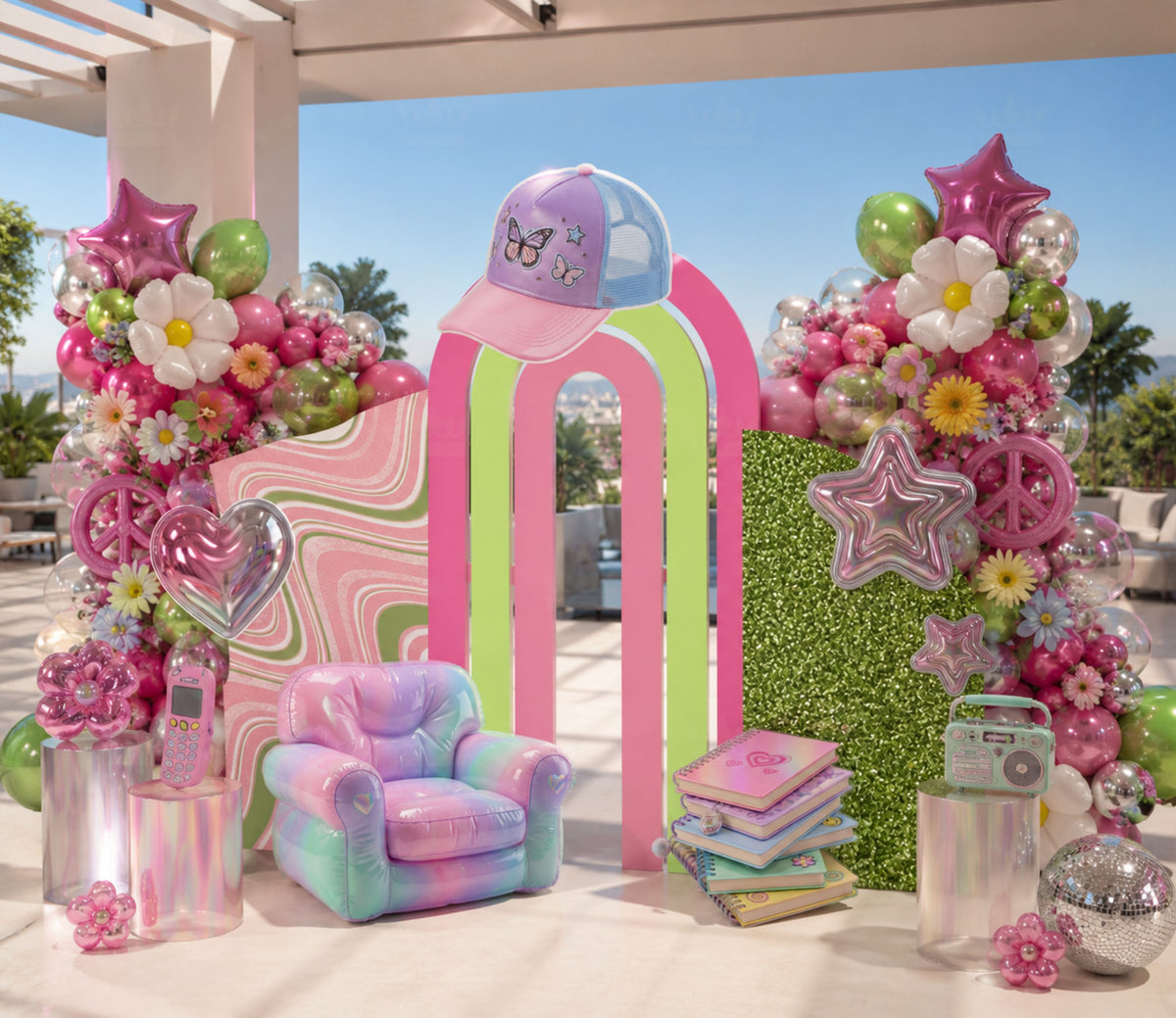 Floral teen girl birthday backdrop with bright pink and green arches, colorful flowers and modern personalized party decorations.
