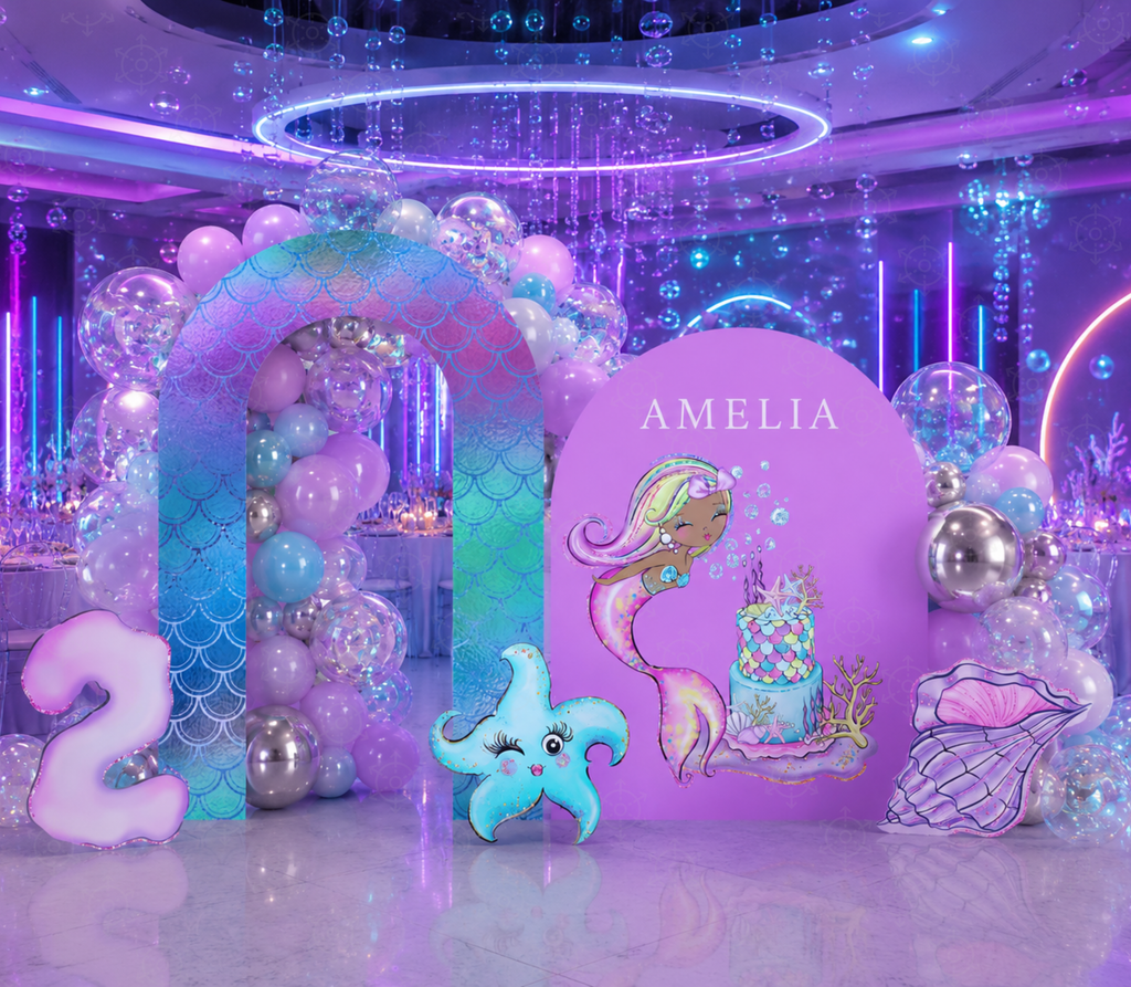 Neon style mermaid birthday backdrop with purple and blue lighting, ocean cutouts and personalized under the sea party decor.