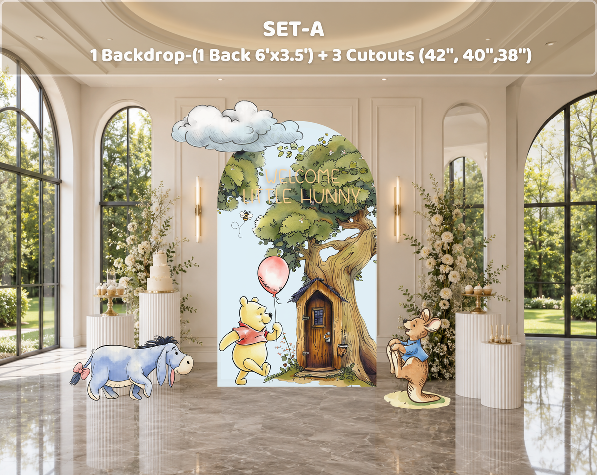 Personalized classic bear party backdrop with blue and ivory arch panels, woodland greenery and character cutouts for a baby shower.