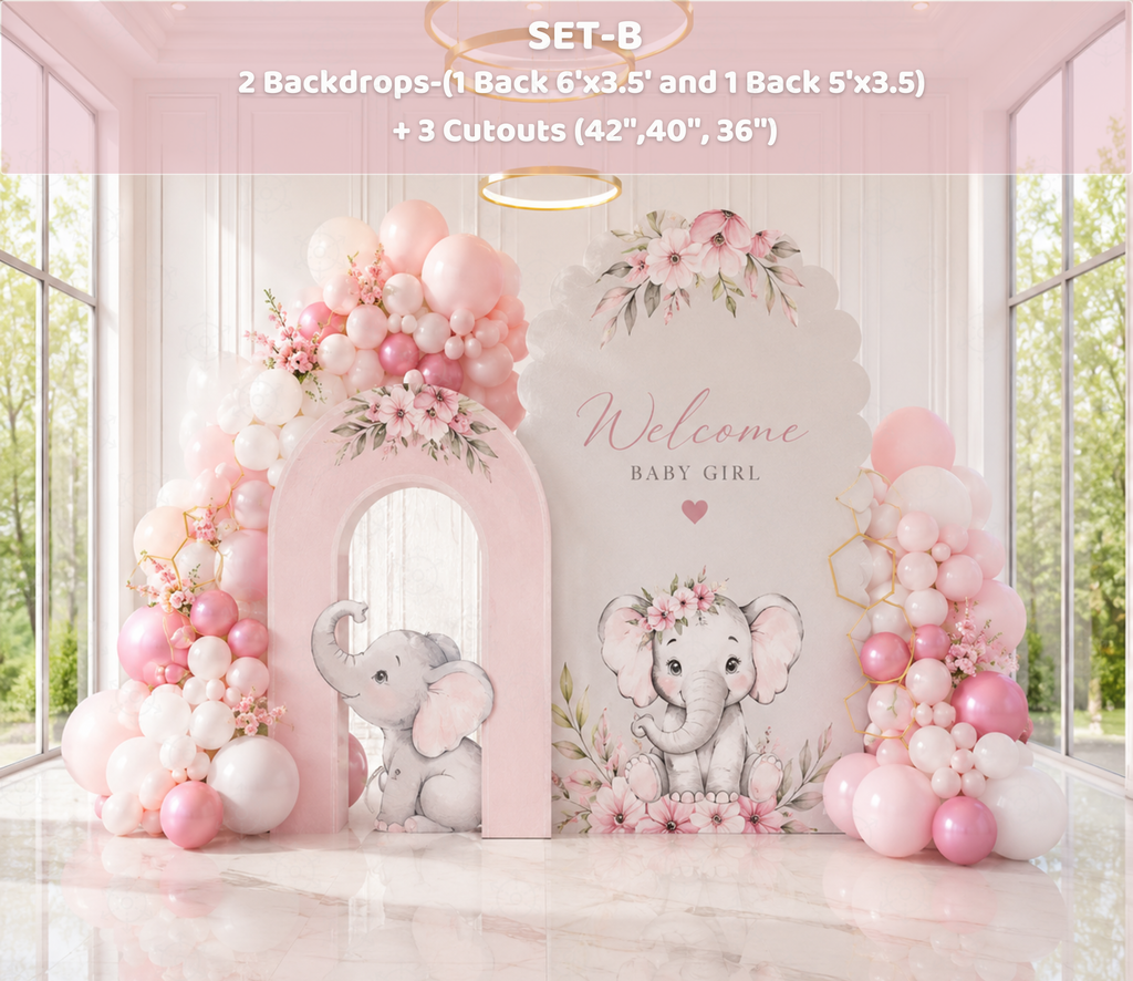 Soft pink baby elephant party backdrop with floral details and matching character cutouts for a baby celebration.