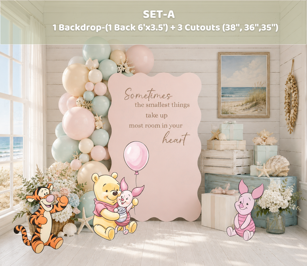 Pastel pink Honey Bear party backdrop with matching character cutouts and elegant indoor balloon decor.