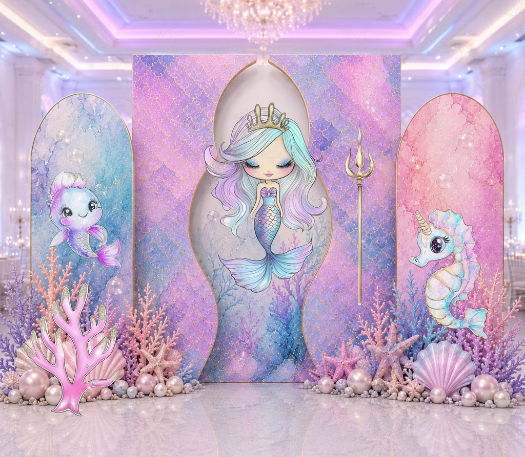 Pastel mermaid birthday backdrop with ocean princess cutouts styled for a girls indoor party