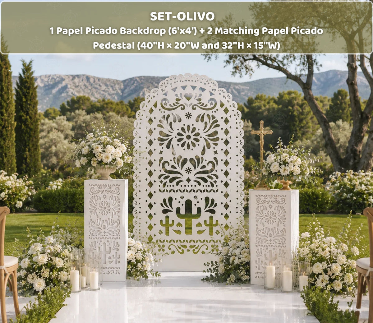 White Papel Picado backdrop and pedestal set styled for an elegant outdoor Mexican celebration