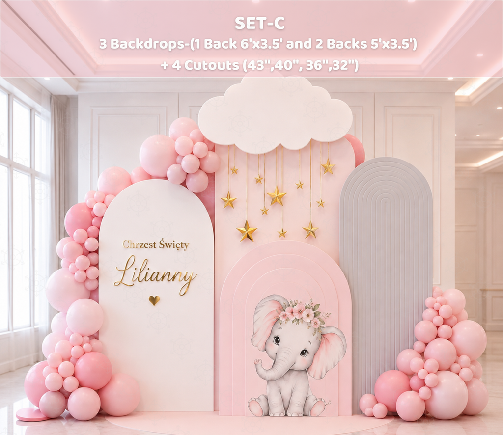Baby elephant baptism backdrop in blush pink and white with matching cutouts and delicate floral party decor
