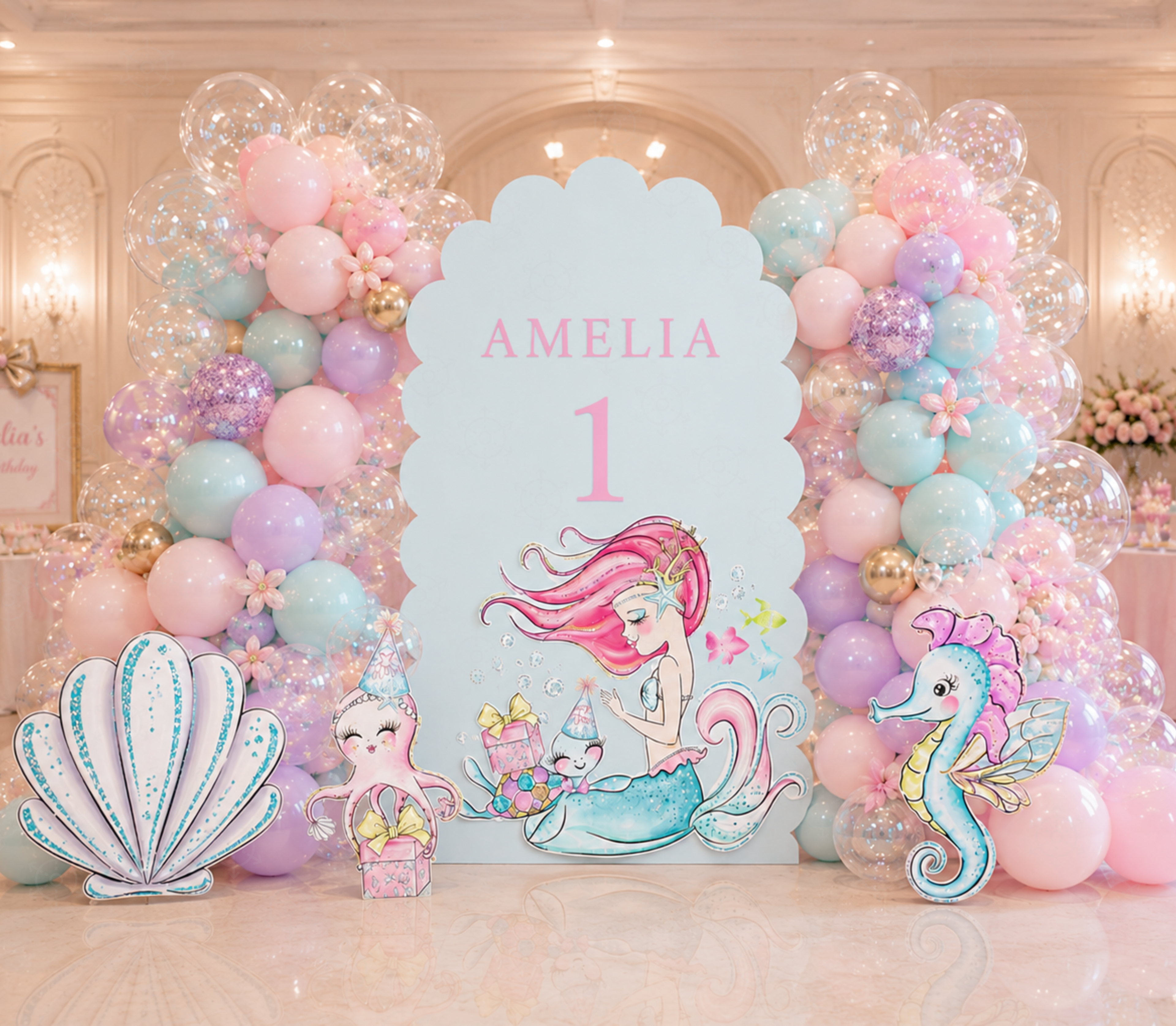 Personalized pink mermaid birthday backdrop with pastel balloons, large seashell cutout and colorful ocean themed party decorations.