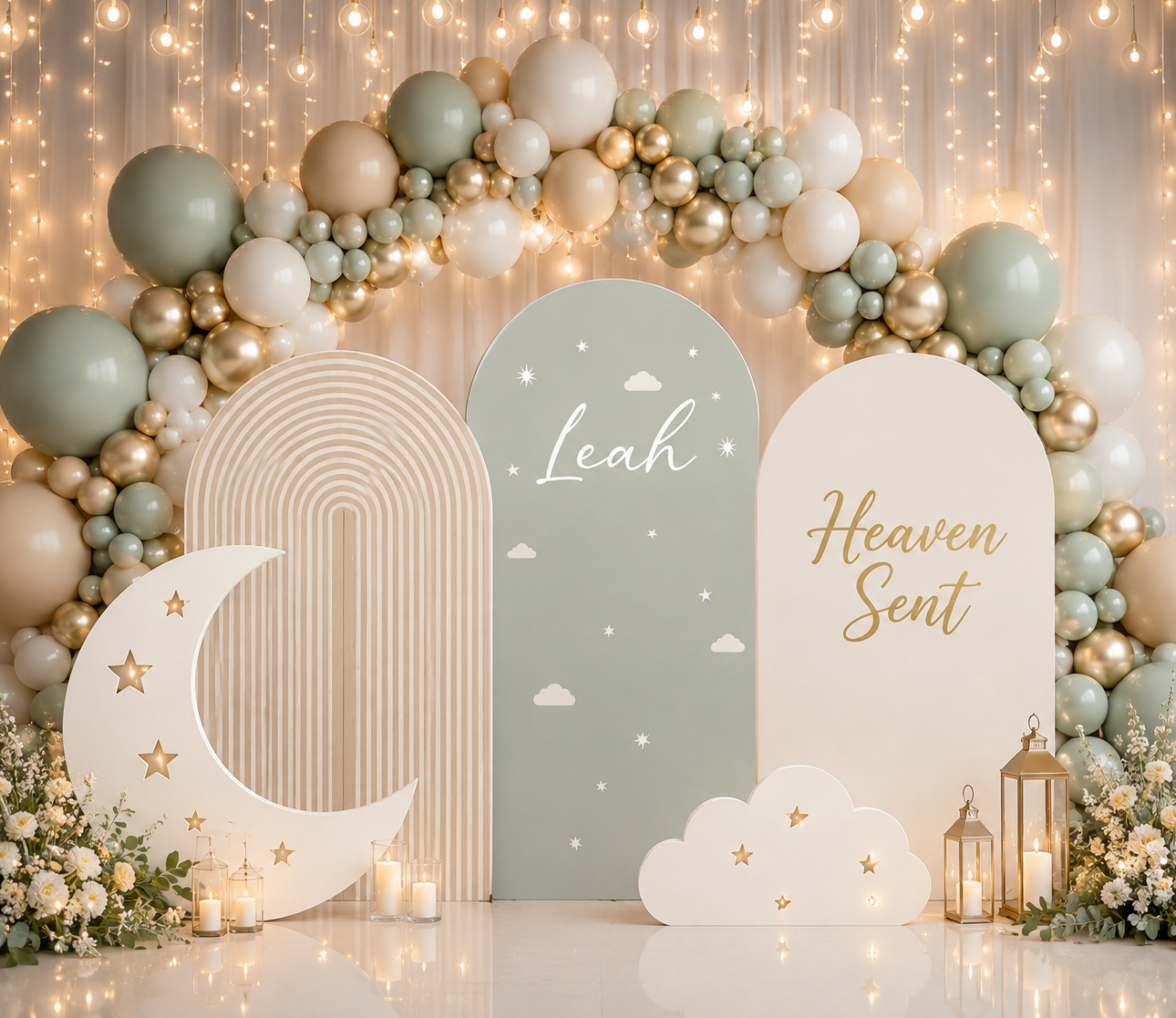 Moon and stars baby shower backdrop with beige and light blue arches, celestial cutouts and soft neutral balloon decorations.
