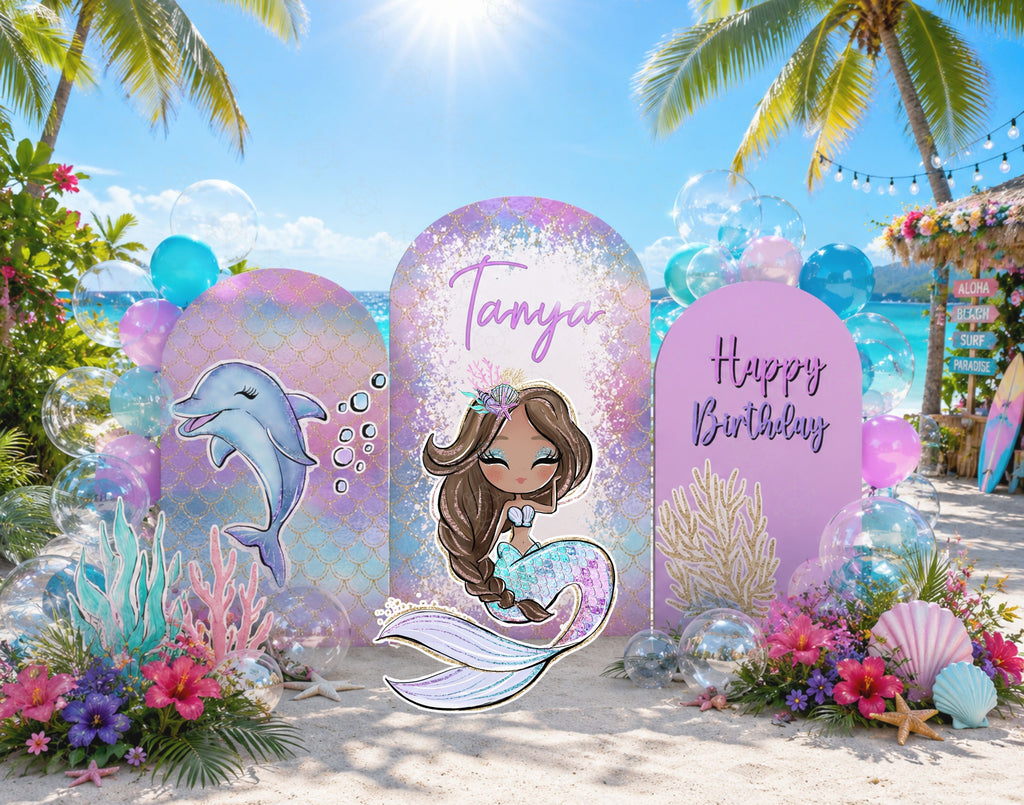 Personalized mermaid birthday backdrop with aqua and pink ocean panels, seashell accents and matching under the sea party decor.