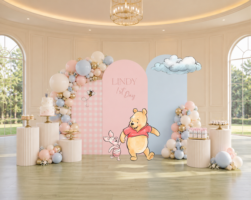 Pastel classic bear baby shower backdrop with peach and blue arches, whimsical character cutouts and soft floral party decor.