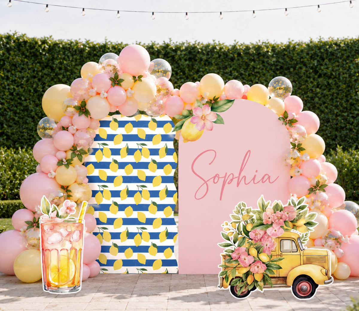 Pink lemon party backdrop with floral arch and personalized celebration decor