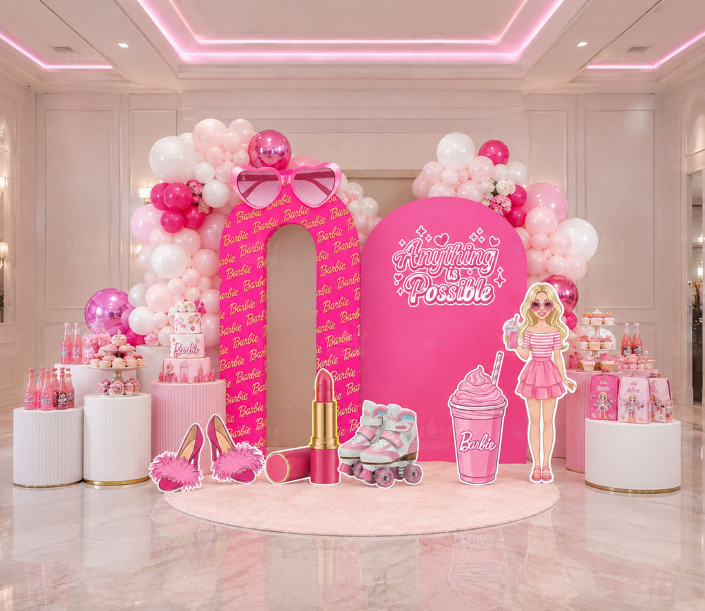 Pink fashion doll party setup with layered backdrop panels, balloon garland and glam birthday decorations for a personalized girls event.