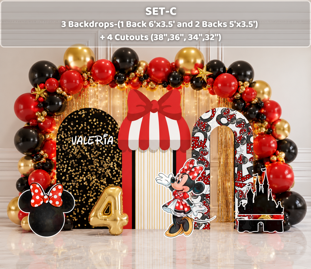Classic mouse birthday setup with black and red arched backdrops, striped panel and red black gold balloon garland