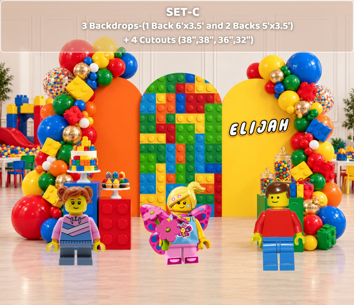 Colorful building block birthday backdrop with personalized name, bright arch panels and balloon garland for a kids party.