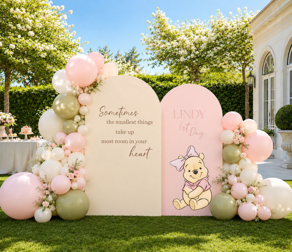 Pastel Honey Bear party backdrop and cutouts styled outdoors with pink and blue balloon decorations.